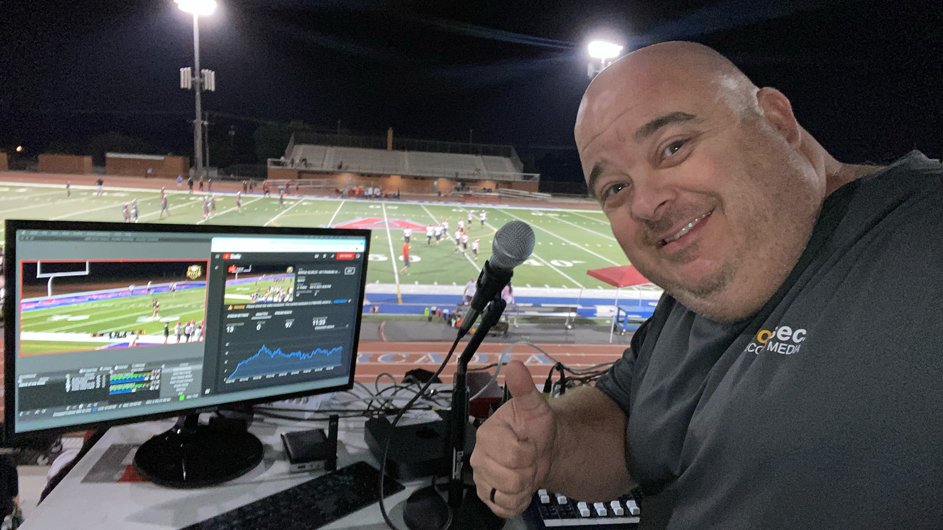 Owner Chris Weir in the early days of Two Second Media producing a live stream at a football game.