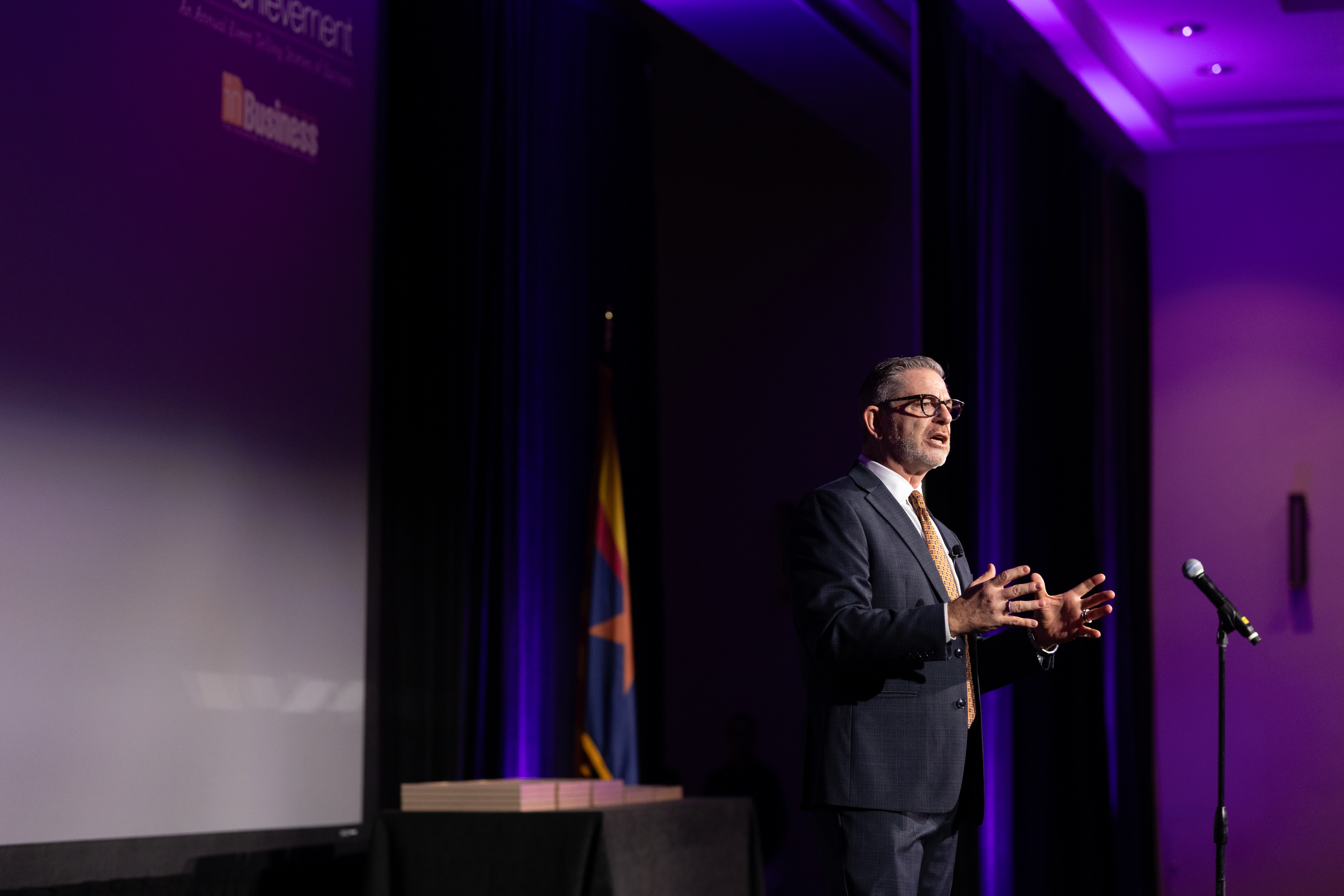Women of Achievement, Rick McCartney speaking on stage during the event at the Arizona Biltmore Resort